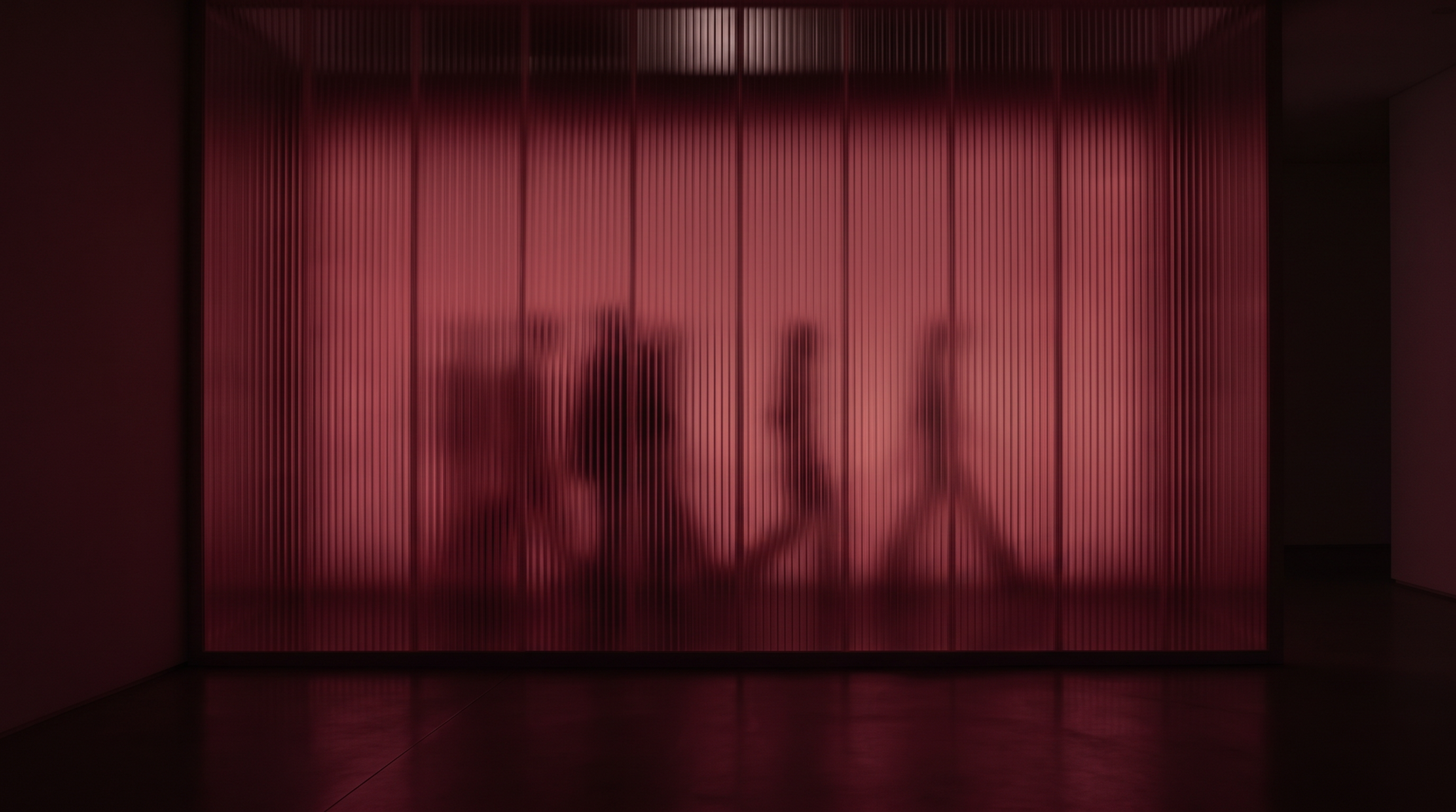 A red curtain with two shadowy figures